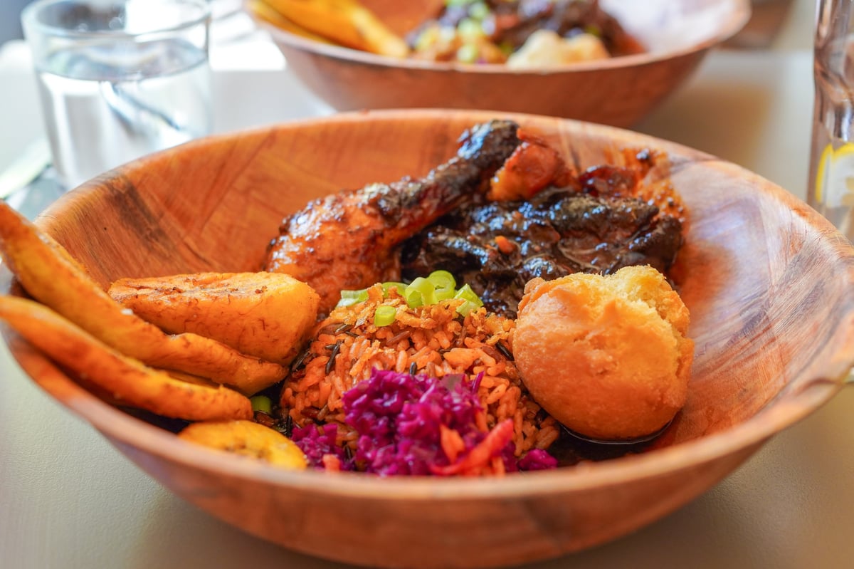 Caribbean rum honey chicken, Jamaican fried dumpling and fried sweet plantain on a platter